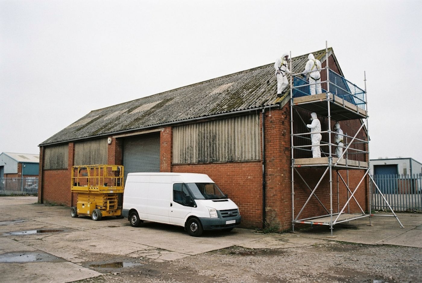 Crew on a scaffold at an industrial unit